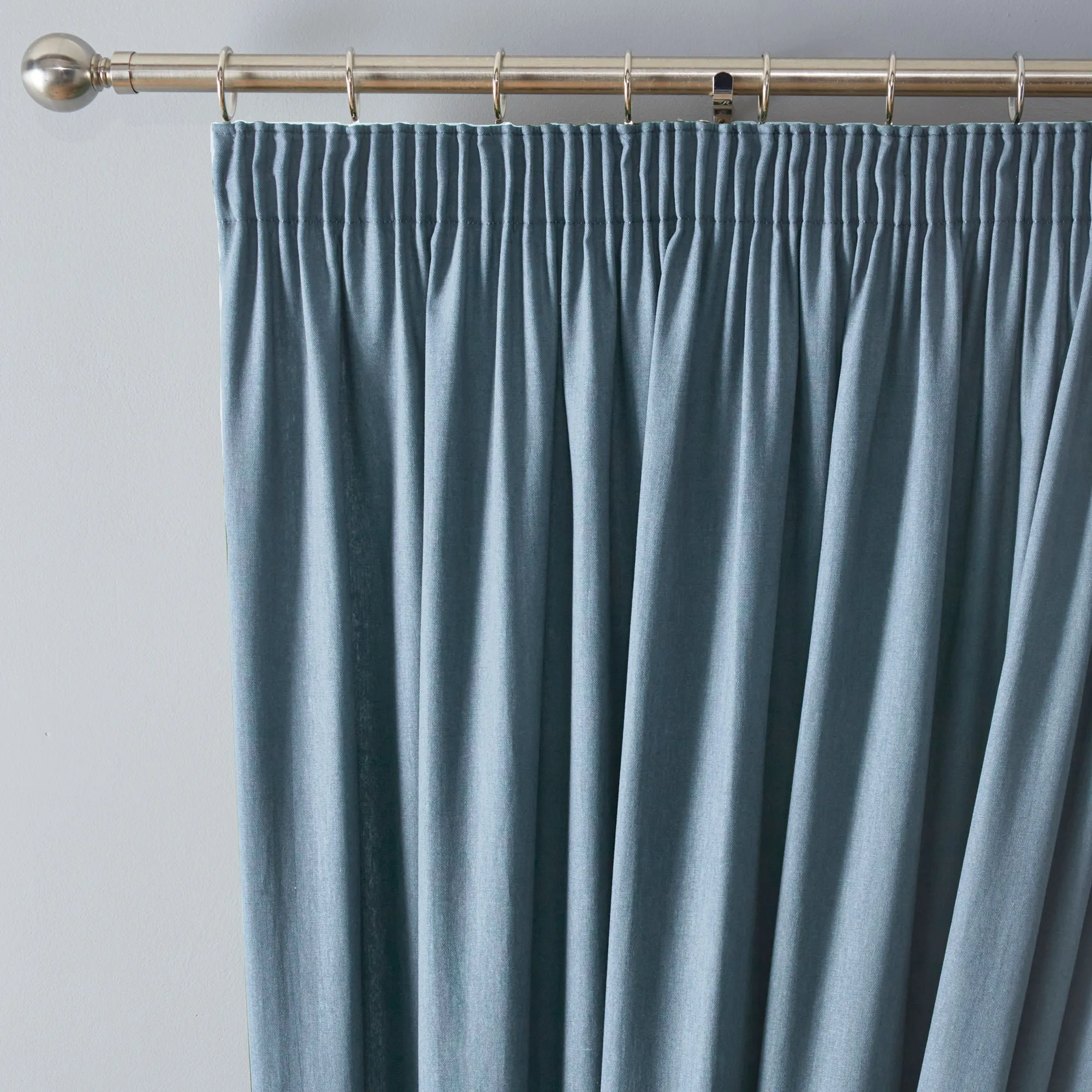 Dijon Pair of Pencil Pleat Curtains by Fusion in Light Blue